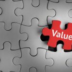 image of a puzzle that is all grey and one piece in red that has text that says value