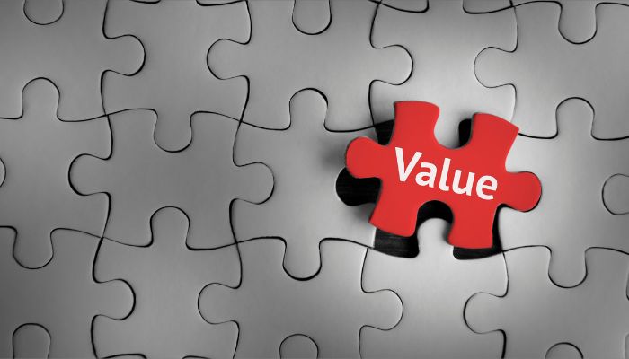 image of a puzzle that is all grey and one piece in red that has text that says value